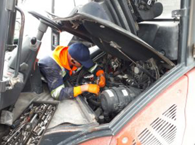 Integralift Sales And Services Inc. technician servicing a forklift
